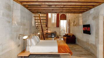 Duplex Cave Suite | Living area | 43-inch flat-screen TV with digital channels, TV, heated floors