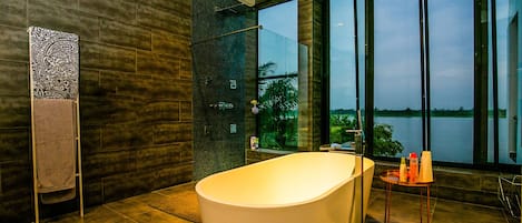 Bathtub, towels, soap, toilet paper