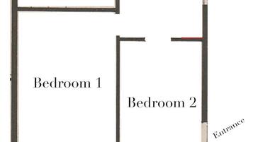 A floor plan with a large terrace, two bedrooms, a bathroom, and a kitchen.