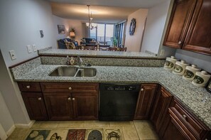 Enjoy meals in the kitchen with a dishwasher and dining area with a table and chairs.