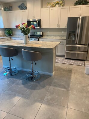 Dishwasher, coffee/tea maker, cookware/dishes/utensils