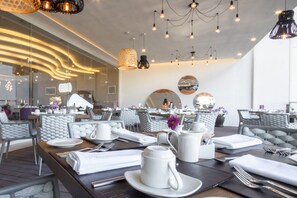 Breakfast, lunch, dinner served; international cuisine, garden views