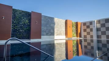 Outdoor pool, open 8:00 AM to 8:00 PM, pool umbrellas, pool loungers