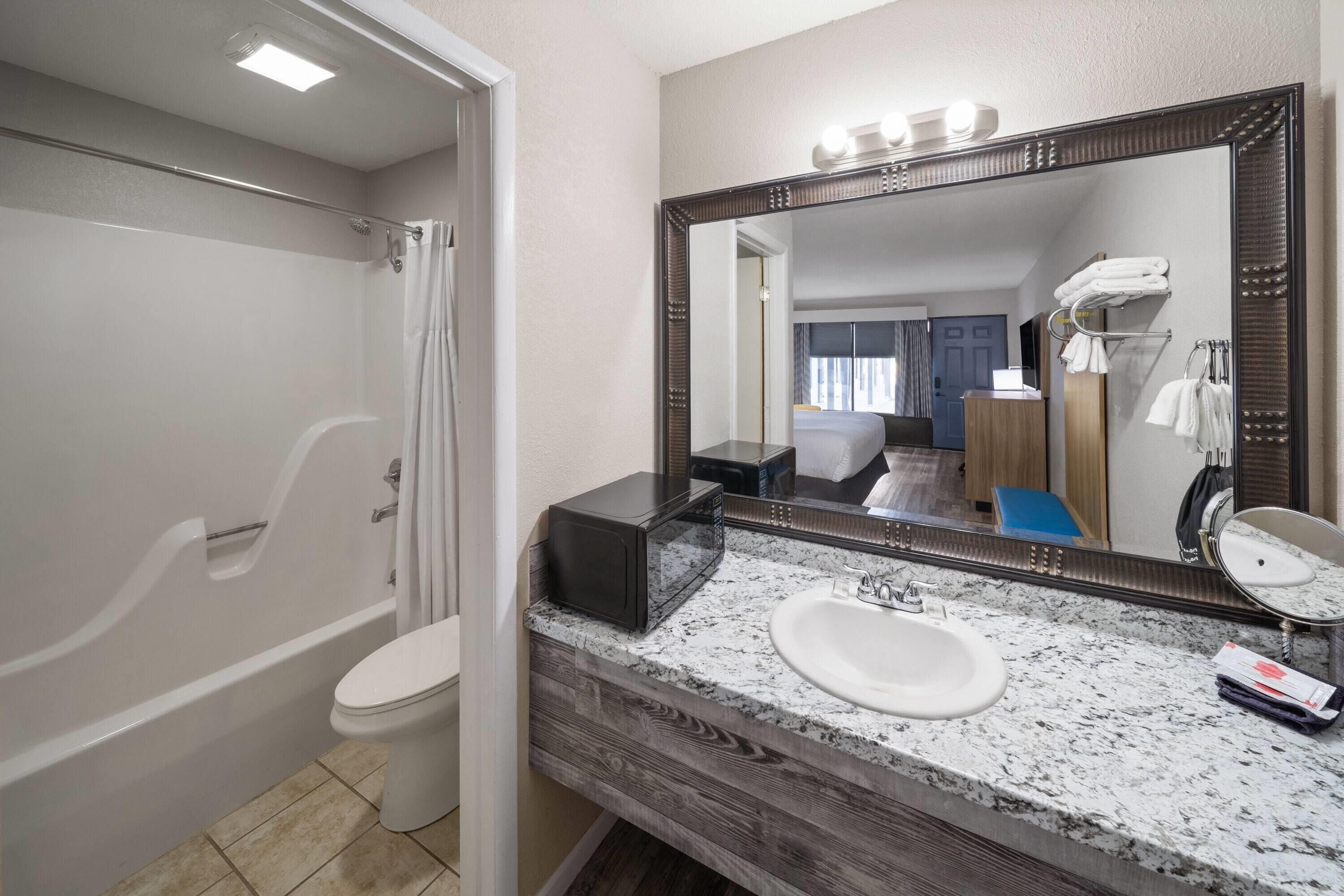 Combined shower/tub, hair dryer, towels, soap