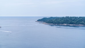A coastal landscape with a forested island and calm sea. - Argenta Rooms - Premium Double Room with Balcony (Dubrovnik)