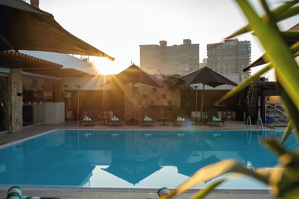 Seasonal outdoor pool, open 7:00 AM to 5:00 PM, lifeguards on site