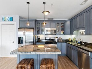 Fridge, microwave, oven, stovetop - Top-floor downtown condo with pool, gym, walk to beach and more | A Skyline View (New Buffalo)