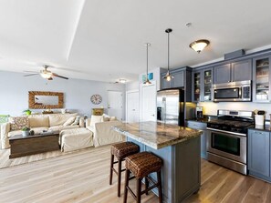 Fridge, microwave, oven, stovetop - Top-floor downtown condo with pool, gym, walk to beach and more | A Skyline View (New Buffalo)