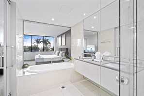 Bathtub, hair dryer, towels, soap