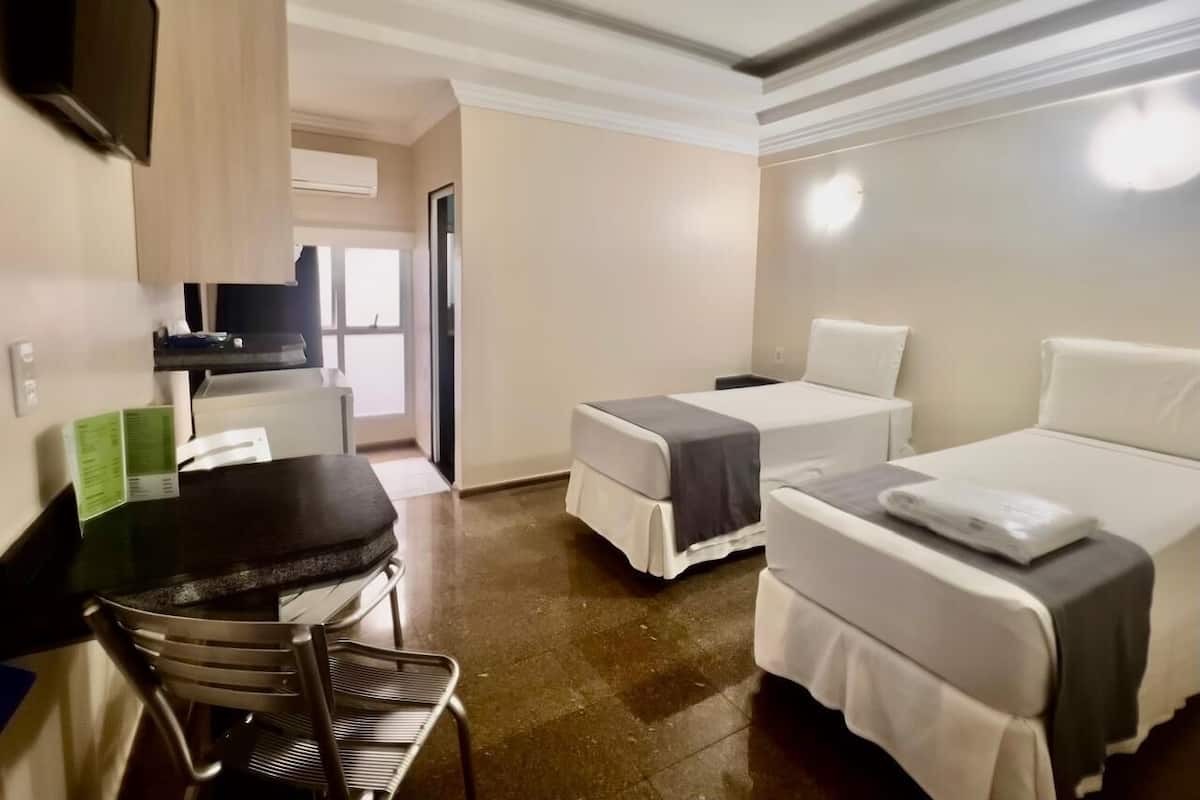 Economy Twin Room | Minibar, WiFi (free), bed sheets