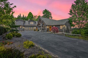 Luxury Smoky Mountains cabin exterior with long driveway, surrounded by trees and mountain scenery. - Cedar Falls Lodge - Luxury Cabin w/Pool | Arcade | Golf Simulator | 6 King Suites (Sevierville)