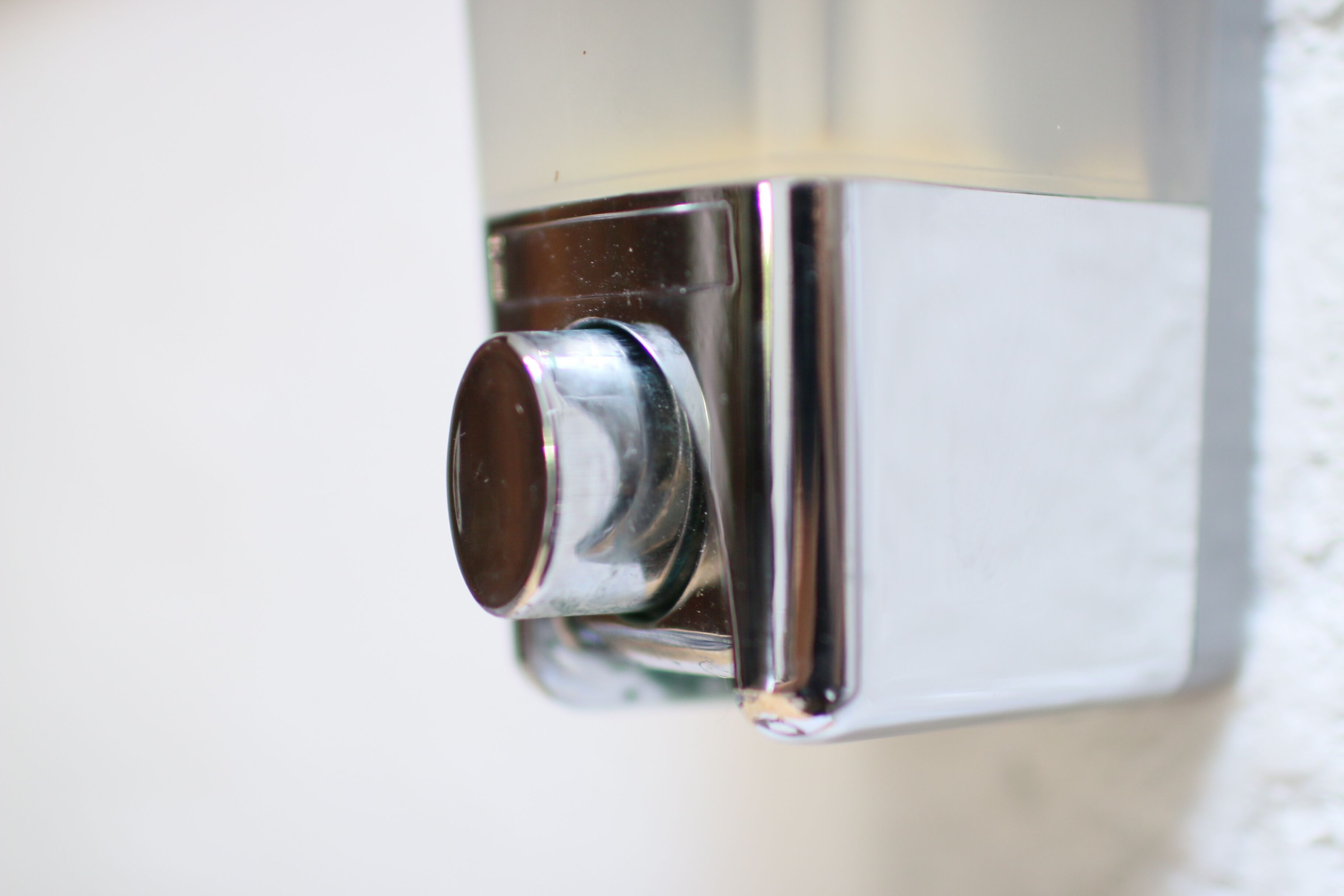 A chrome faucet with a single handle.