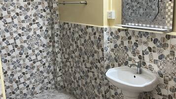 Shower, towels, soap, toilet paper