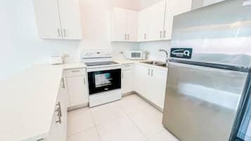 Fridge, microwave, cookware/dishes/utensils