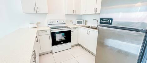 Fridge, microwave, cookware/dishes/utensils