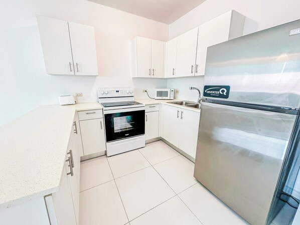 Fridge, microwave, cookware/dishes/utensils