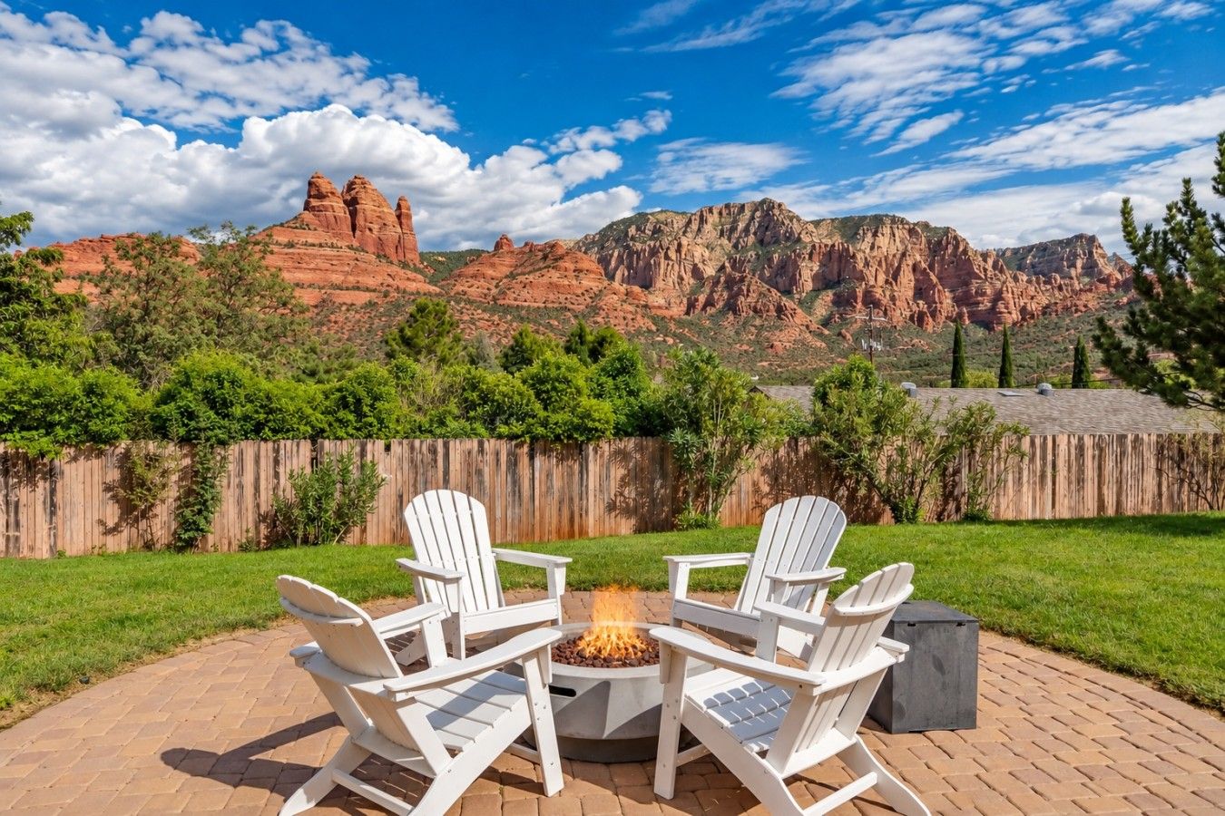 - Fire pit circle with Adirondack chairs and mountain views   - Expansive lawn offers plenty of outdoor gathering space   - Scenic red rock backdrop creates unforgettable evenings