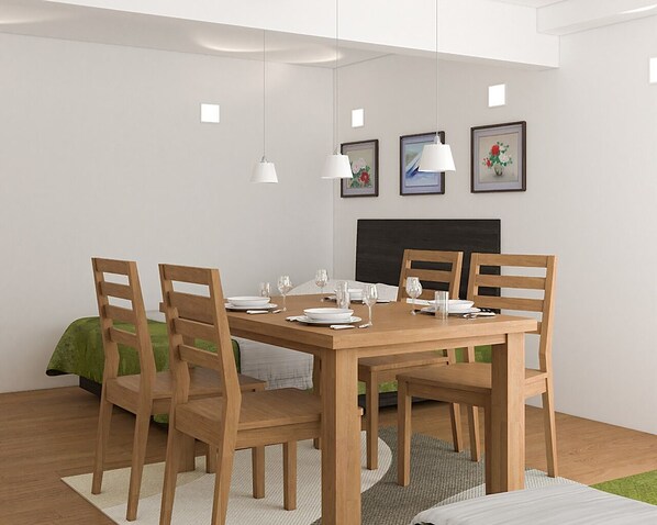 A dining area with a wooden table, four chairs, and a green bed in the background. - Asakusa HomeSuites Tokyo (Tokyo)