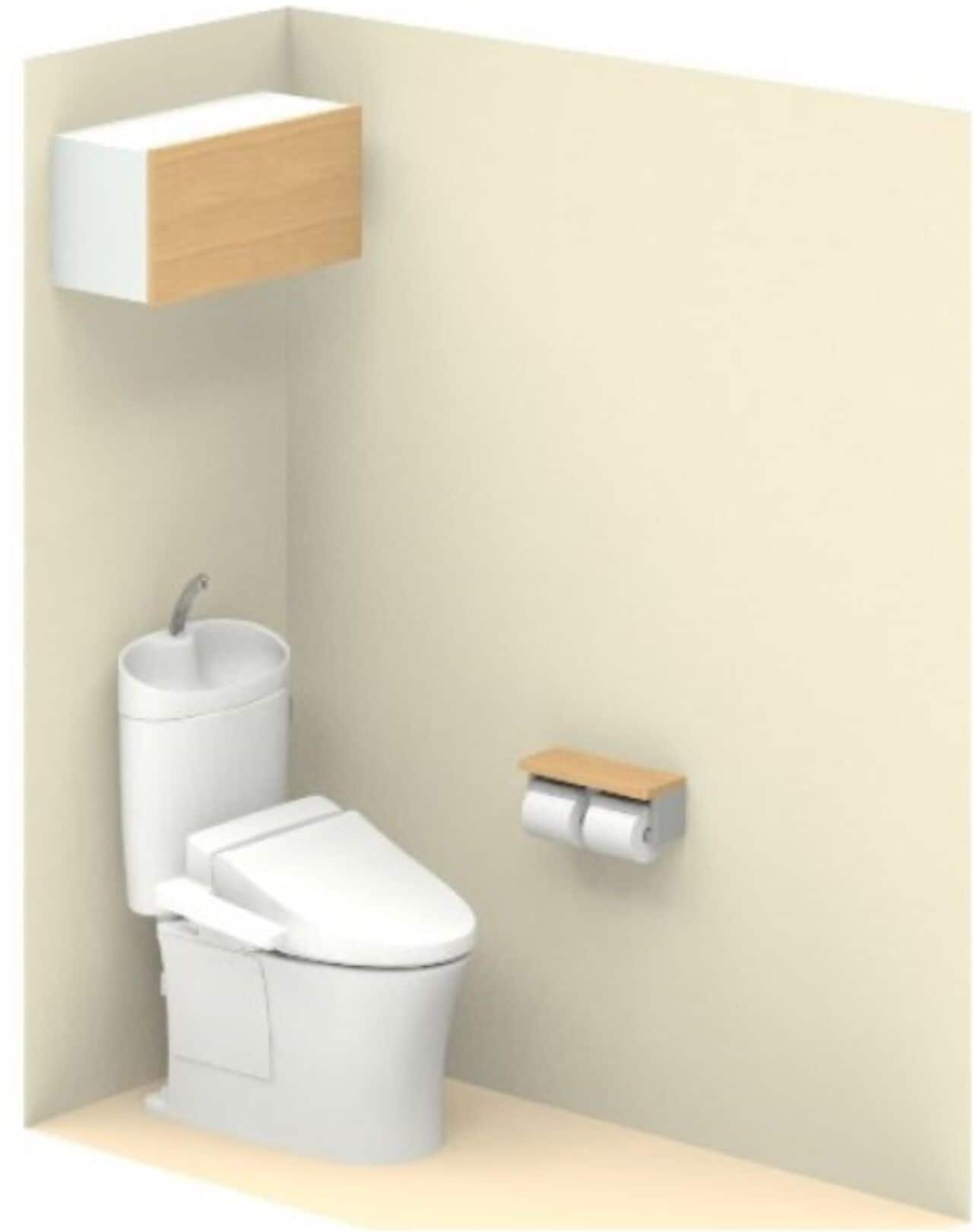 A bathroom with a toilet, a sink, and a toilet paper holder.