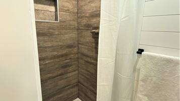 Combined shower/tub, hair dryer, towels, soap
