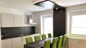 A modern kitchen with a dining area. - für bis zu 8 Personen mit IR Sauna by Interhome (Eisenerz)