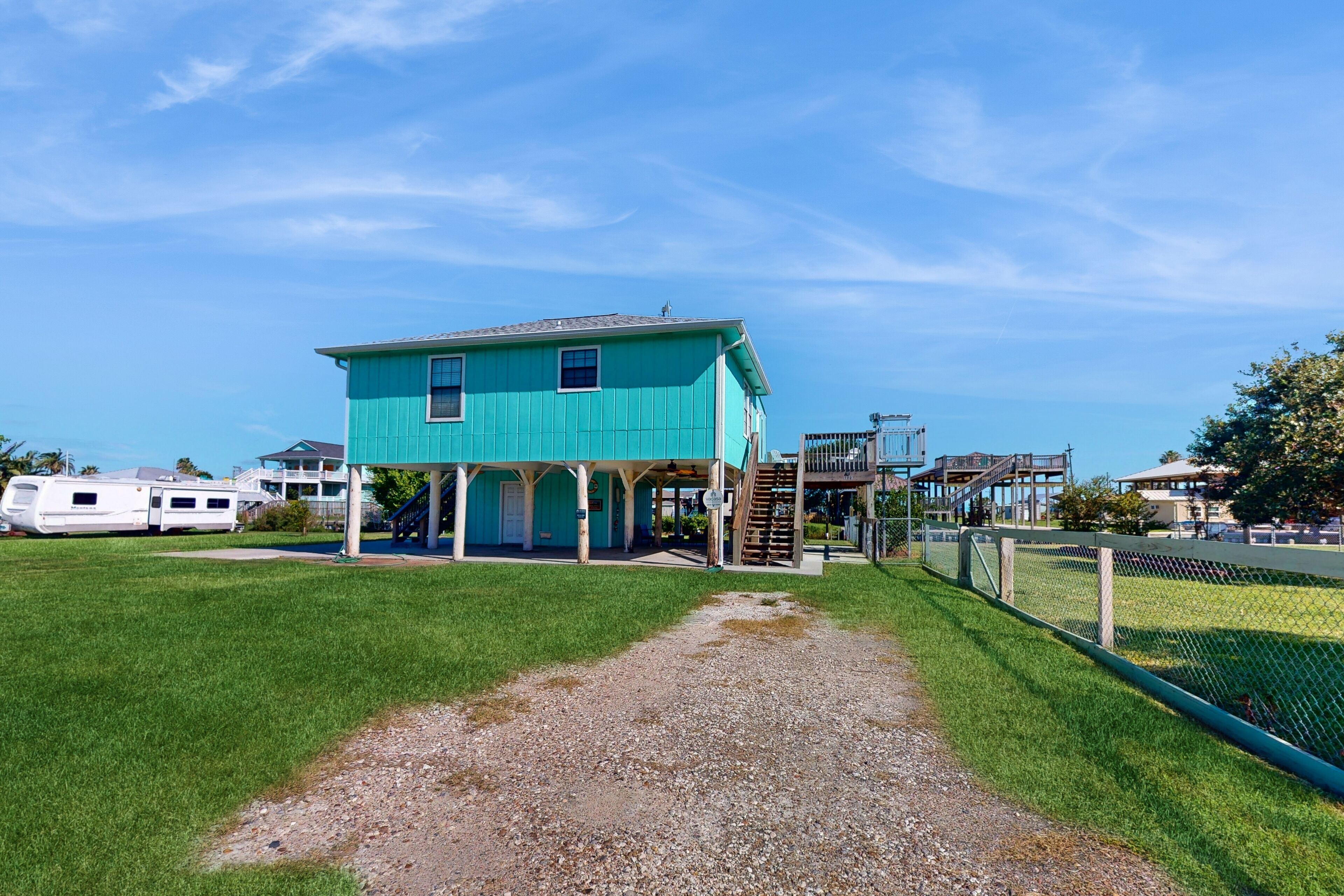 Dog-friendly, canal-front home with boat ramp, dock, large yard, WiFi, & AC