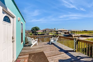 Relax on the deck with Adirondack chairs, steps from the marina and water activities.