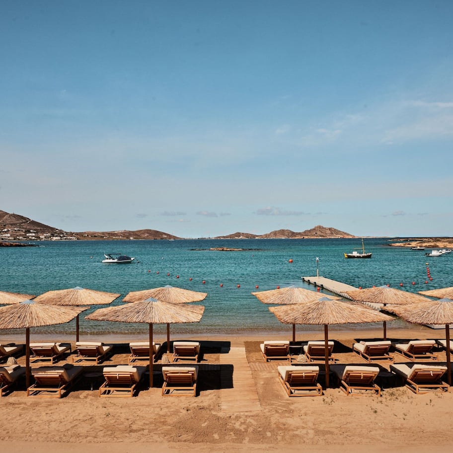On the beach, sun loungers, beach umbrellas, beach towels