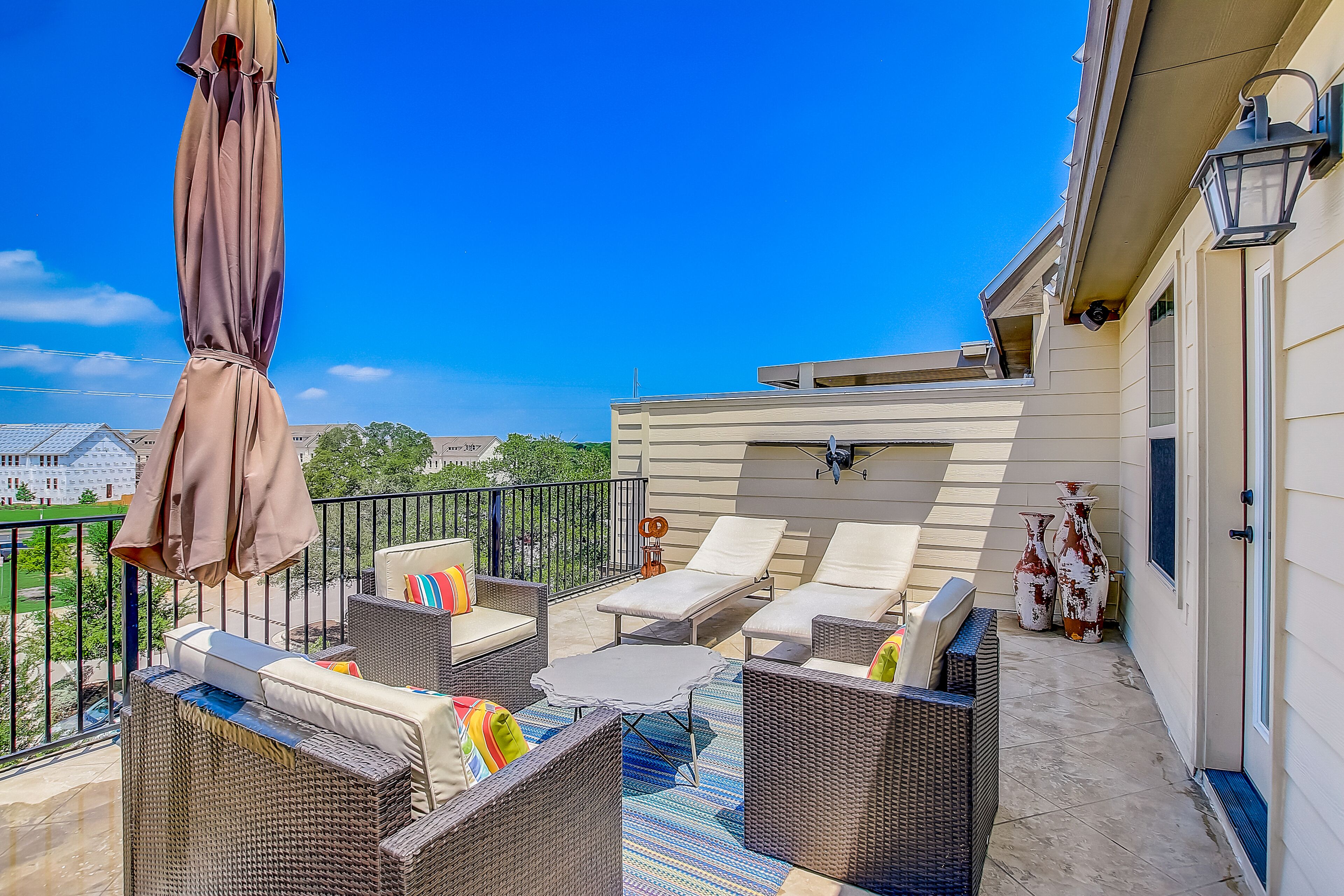 Upscale four-story townhome next to park with elevator, rooftop terrace, & WiFi