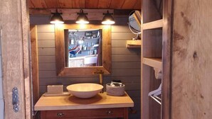 A wooden bathroom vanity with a large mirror, three pendant lights, and a bowl sink. - 1 Bed Cabin in the Magical Galloway Forest Park (Newton Stewart)