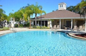 Relax by the pool surrounded by lush greenery and enjoy the views from the rooftop.