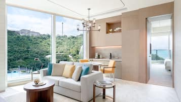 Deluxe Oceanfront Balcony Suite | Living area | 55-inch Smart TV with satellite channels, TV