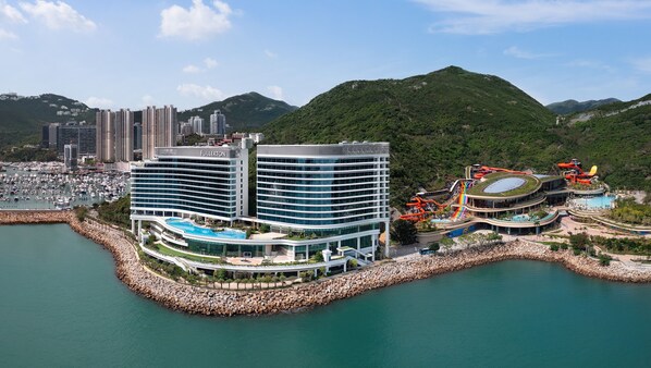 A hotel with a marina, multiple swimming pools, and a water park with slides and a lazy river. - The Fullerton Ocean Park Hotel Hong Kong (Hong Kong)