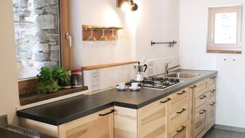 Fridge, highchair, cookware/dishes/utensils, dining table