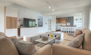 Loftsleilighet – exclusive | Oppholdsområde | En 40-tommers Flatskjerm-TV med digitale kanaler samt TV