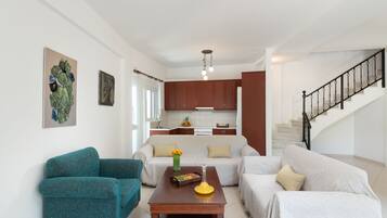 Comfort Duplex | Living area | 32-inch flat-screen TV with cable channels, TV, fireplace