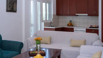 Comfort Duplex | Living area | 32-inch flat-screen TV with cable channels, TV, fireplace