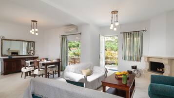 Comfort Duplex | Living area | 32-inch flat-screen TV with cable channels, TV, fireplace