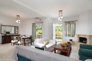 Comfort Duplex | Living area | 32-inch flat-screen TV with cable channels, TV, fireplace