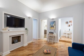 Appartamento City | Area soggiorno | TV a schermo piatto