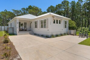A single-story house with a covered porch and a front yard.