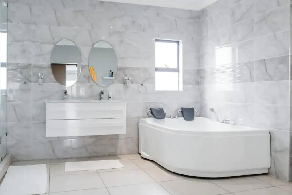 Bathtub, hair dryer, towels, soap