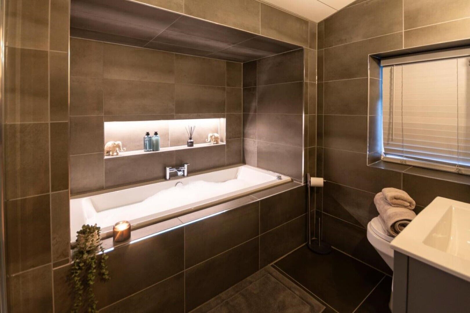 Bathtub, hair dryer, towels, soap