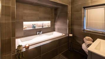 Bathtub, hair dryer, towels, soap