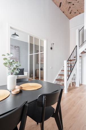 Deluxe Apartment | Dining room. Stylish Historical Loft with Sauna & Free Parking