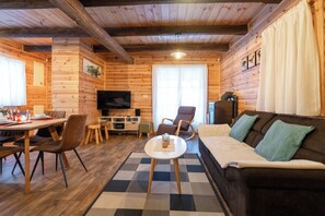 Family Chalet, Multiple Bedrooms, 2 Bathrooms, Mountainside (Chalet Markoci With Hot Tub) | Living area | 21-inch TV with digital channels, fireplace, stereo