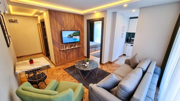 Superior Apartment | Living area | 32-inch LCD TV with cable channels, TV - Letstay Sweet Home Mint (Antalya)