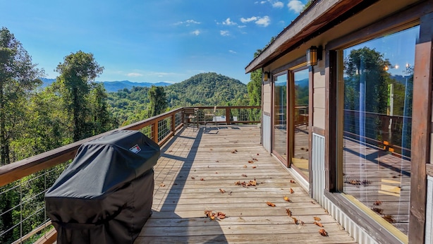 A wooden deck with a grill, overlooking a forested mountain range. - Stackstone Ridge- Gorgeous View! (Bryson City)