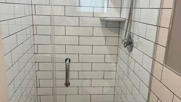 Shower, hair dryer, towels, shampoo