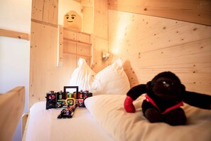 Relax in this inviting bedroom with a plush bed and a wooden headboard.